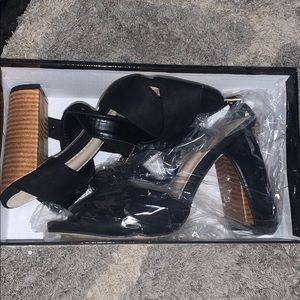 Black and brown heeled sandals with straps